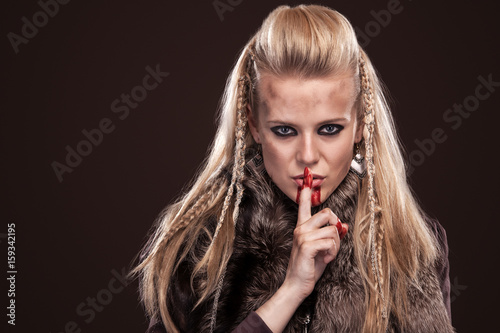 Fotografie, Obraz Portrait of viking woman in a traditional warrior clothes.