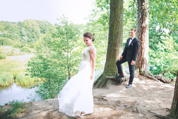 Groom and bride together. Wedding couple. newlyweds bride and groom at a wedding in nature green forest