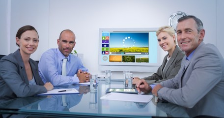 Poster - Composite image of business team looking at white screen