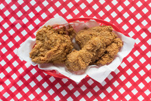 Fried Chicken Basket On Red Checkerboard Tablecloth