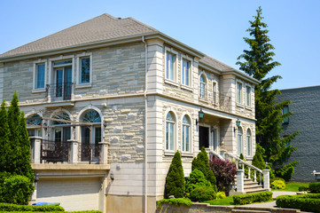 Wall Mural - Expensive modern large white house with huge windows in Montreal, Canada.