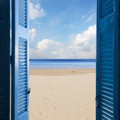 room with open door to seascape and sand beach - vacation concept