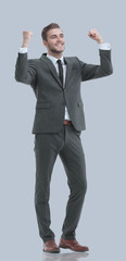 Excited smile business man raised arms, isolated over gray backg