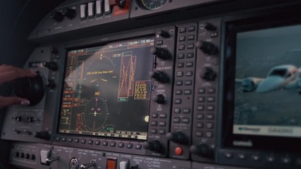 Navigation panel in airplane cockpit. Close up of female hand tuning airplane navigation system. Plane navigation panel. Female hand touching plane control panel. Airplane control panel screen. Gps