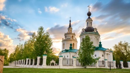 Wall Mural - Timelaps of clouds over Russian ortodox church at sunset. Bolshoe Boldino, Russia