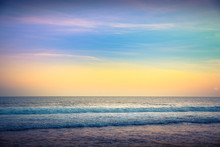 Water Sunset Background. Clear Tropical Island View And Sunset Beach Background. Sunset Waves And Amazing Landscape Ocean. Orange Ocean Beach. Sun Rays In A Colorful Sunset Background. Beautiful Sky
