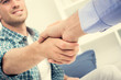 © Atstock Productions - Men in casual clothes making handsdhake