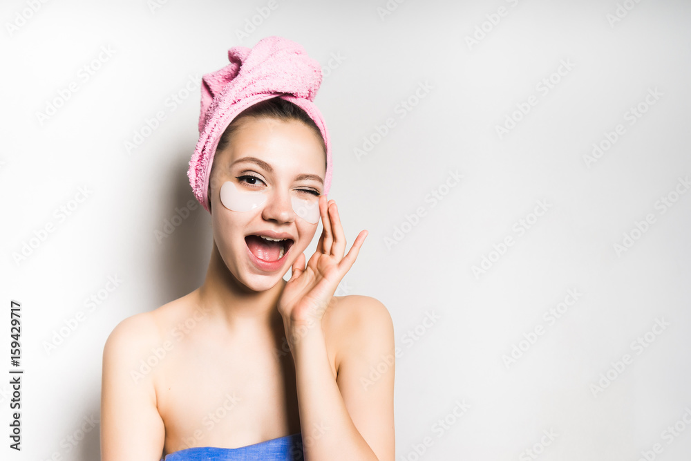 Beauty skin care young emotional teen woman close up,cream on face