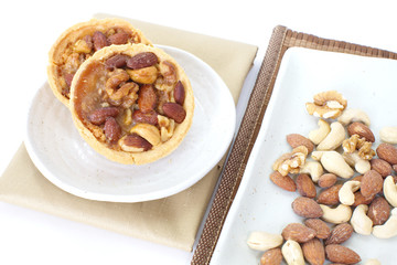 Canvas Print - Mixed nuts and a baked dish tart