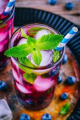 Wall Mural - Blueberry ice lemonade with mint in glasses