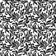 Elegant seamless pattern. Tracery of swirls and decorative leaves isolated on a white background. Vintage style. It can be used for printing on fabric, wallpaper, wrapping