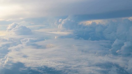 Wall Mural - clouds while flight.view through an airplane window.
