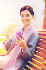 Canvas Print - smiling woman with coffee and smartphone