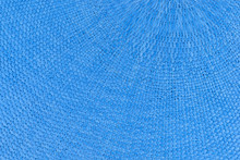 Close View Of A Blue Woven Place Mat.