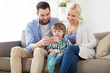 © Syda Productions - happy family with smartphone at home
