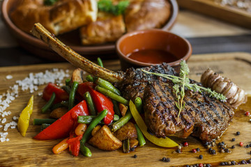 Fried meat with vegetables on the board