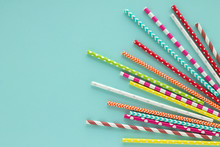 Drinking Paper Colorful Straws For Summer Cocktails On Light Blue Background.