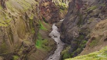 Wide High Angle Shot Of River Flowing In Gorge . Rangarvallasysla, Iceland