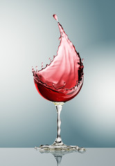 red wine glass on gray background