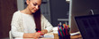 © shefkate - Young woman working in office, sitting at desk