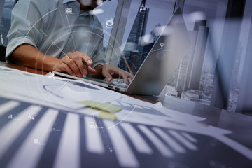 Poster - businessman working with mobile phone and digital tablet and laptop computer on wooden desk in modern office with VR icon diagram