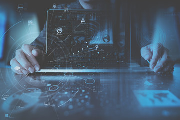 Poster - businessman hand working with modern laptop computer in modern office with virtual icon diagram