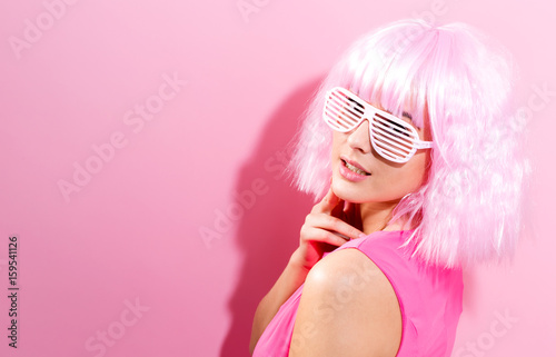 Beautiful woman in a bright pink wig