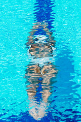 Wall Mural - Female swimmer on training in the swimming pool