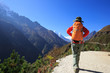 © lzf - Young woman backpacker trekking at the himalaya mountains