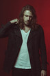 © LIGHTFIELD STUDIOS - Handsome stylish long haired man posing in studio