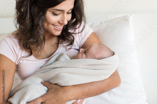 Fototapeta Mother holding newborn baby