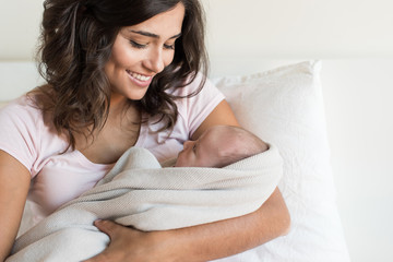 Wall Mural - Mother holding newborn baby