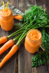 Wall Mural - Fresh carrot smoothie in jars