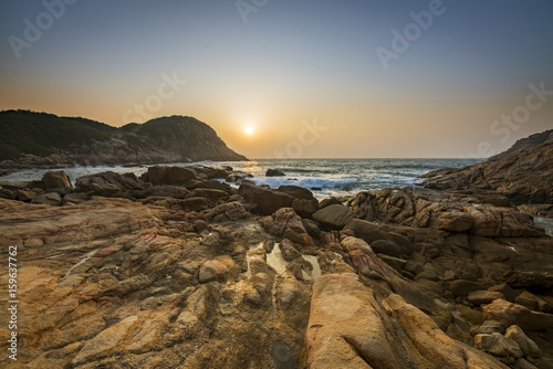 Fotografering Sunrise over Shek O beach, Hong Kong