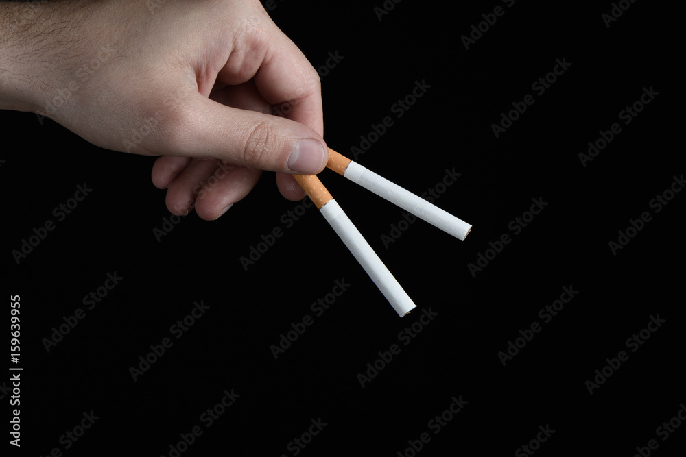 holding cigarette between fingers Woman Stock Photo - Download Image Now - Addict, Addiction, Adult Smoking Man Holding Cigarette between
