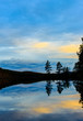 Trees reflecting from wilderness lake in Lapland