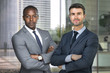 © elnariz - Wealthy and successful CEO business men standing in financial building with look of success and wealth
