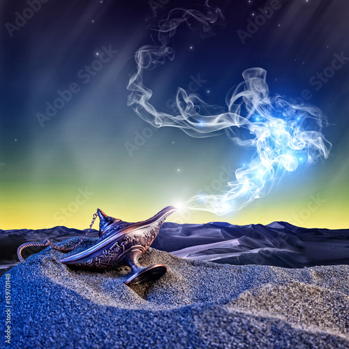 Fotomural magical aladdin lamp with smoke coming out in a night resting on the dunes of a desert