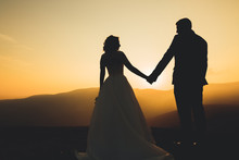 Wedding Couple Posing On Sunset At Wedding Day. Bride And Groom In Love