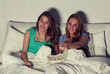 © Syda Productions - happy friends with popcorn and watching tv at home