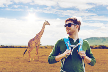 Poster - happy man with backpack traveling in africa