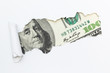 Portrait of Benjamin Franklin on a hundred dollar bill in the gap (hole) of a white background. Dirty money, illegal income. Criminal money.