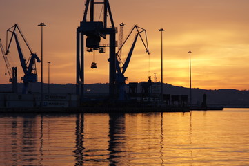 The romantic landscape of seaport in the Golden sunset hour.