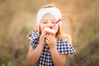 © MeganBetteridge - Patriotic girl with fourth of July cupcake