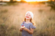 © MeganBetteridge - Patriotic girl with fourth of July cupcake