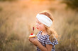 © MeganBetteridge - Patriotic girl with fourth of July cupcake