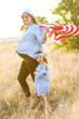 © MeganBetteridge - Patriotic mother and daughter with American flag
