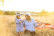 © MeganBetteridge - Patriotic mother and daughter with American flag