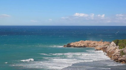 Wall Mural - Ocean waves crashing in a rocky coast of Labadee, Haiti