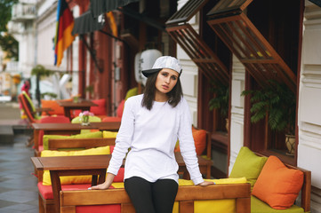 Wall Mural - Fashion model on the street. Beautiful young woman in stylish summer clothes